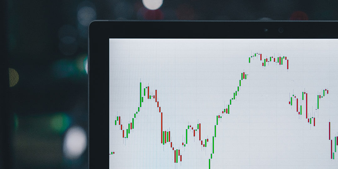 computer screen with red and green graph up and down