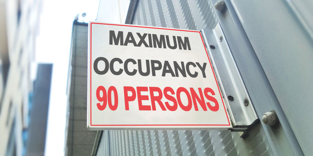 Sign that reads "Maximum occupancy: 90 persons"