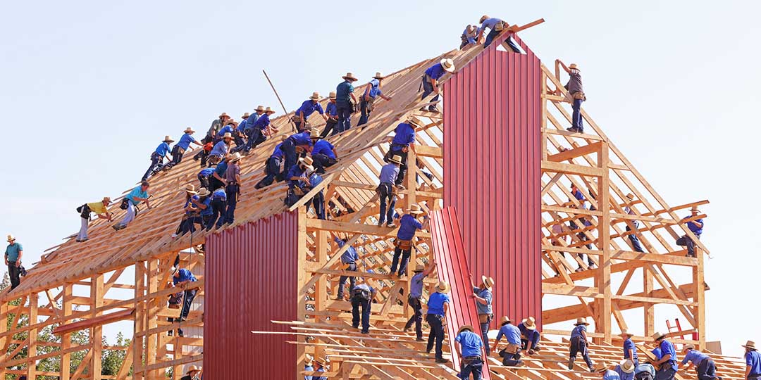 People constructing a building